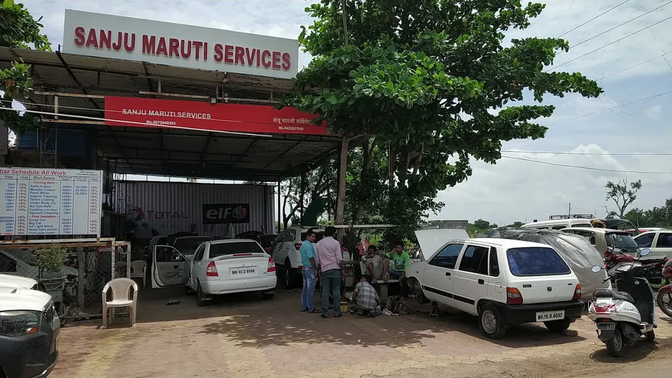 Sanju Maruti Services workshop front with cars parked outside